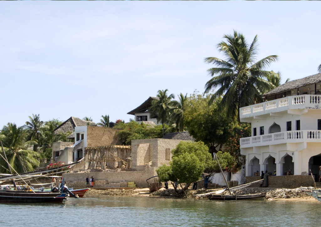 A boat is docked in front of a house on Lamu Island.