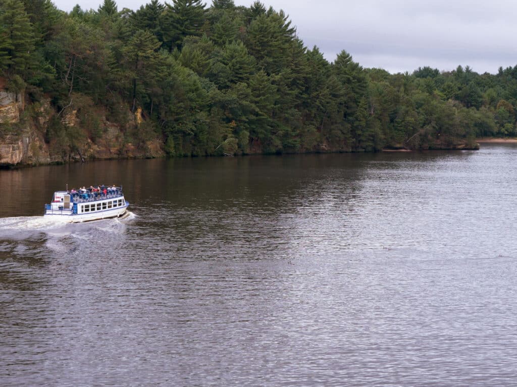 Cruising the scenic river, boat tour. Landscape, summertime, cloudy day. Wisconsin river, Wisconsin Dells.