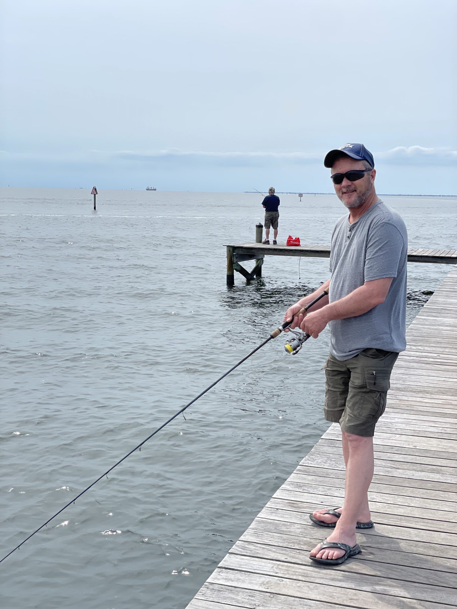 Fishing off the pier in Ruskin, Florida by Bahia Beach