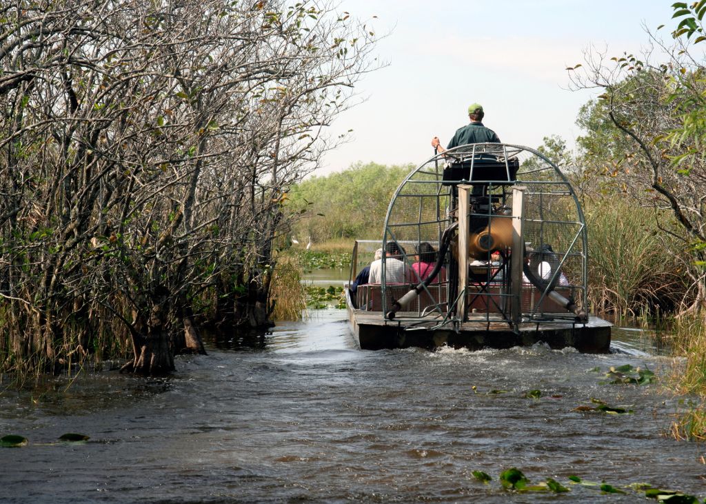 Everglades boat tour in Florida with an airboat cruising along a waterway