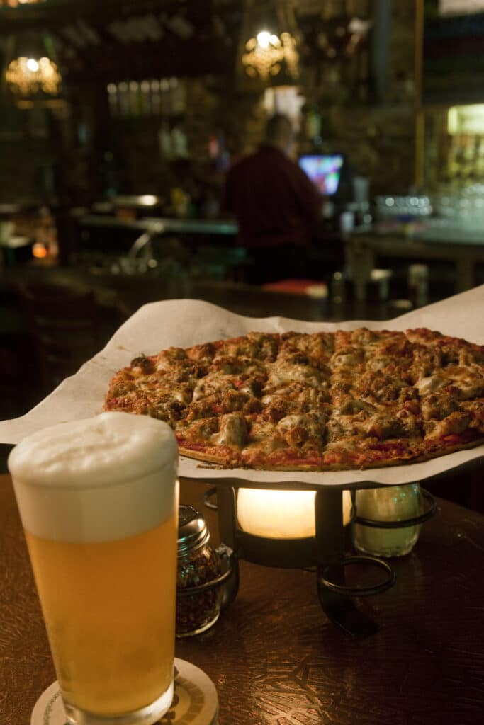 The Stone Arch Brewpub in Appleton, Wisconsin's sausage pizza and a tap beer