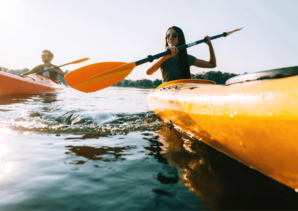 Two people paddling in a kayak on Lake Geneva, WI.