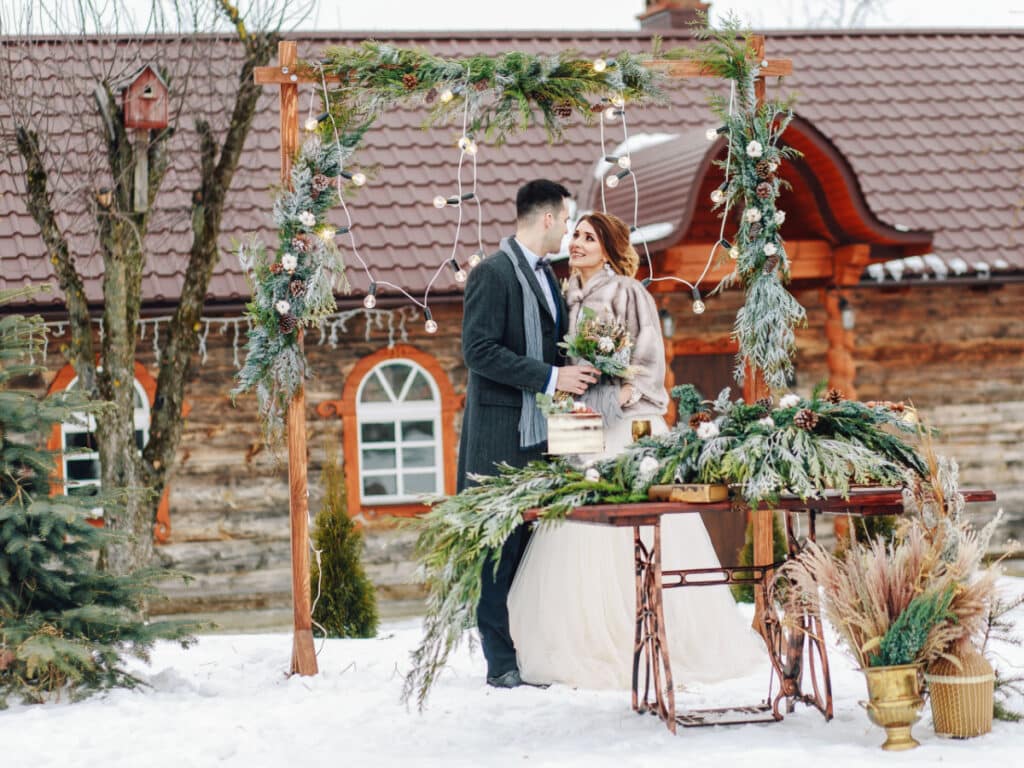 Beautiful wedding ceremony outdoors. Wedding decorations. Wedding in winter. Wedding in rustic style. Fairy tail