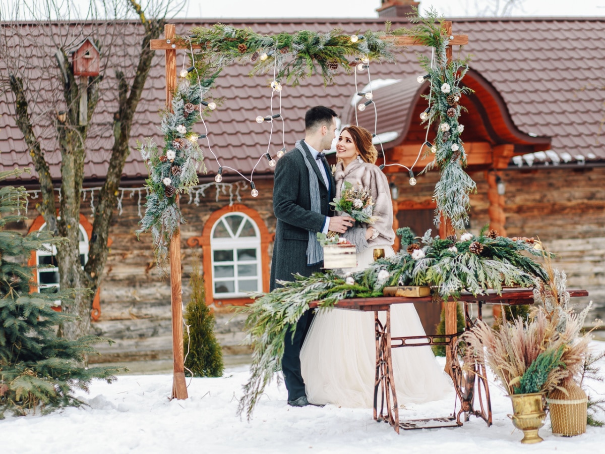 Beautiful wedding ceremony outdoors. Wedding decorations. Wedding in winter. Wedding in rustic style. Fairy tail