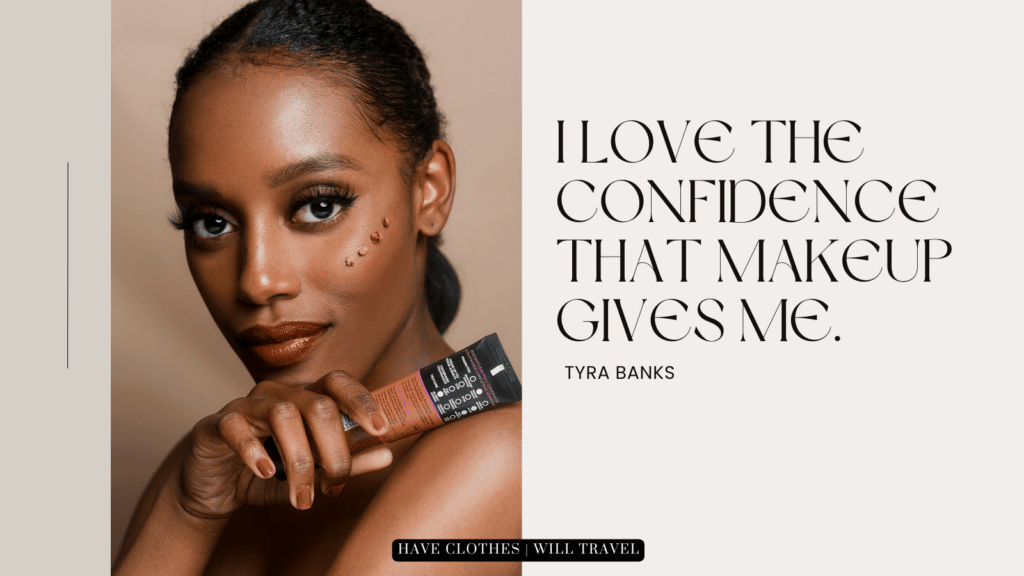 A graphic of text next to an image of a beautiful black woman with dots of foundation on her cheek. She's holding a tube of foundation in her hand. Text on the image shares a makeup quote that says, "I love the confidence that makeup gives me. - Tyra Banks"