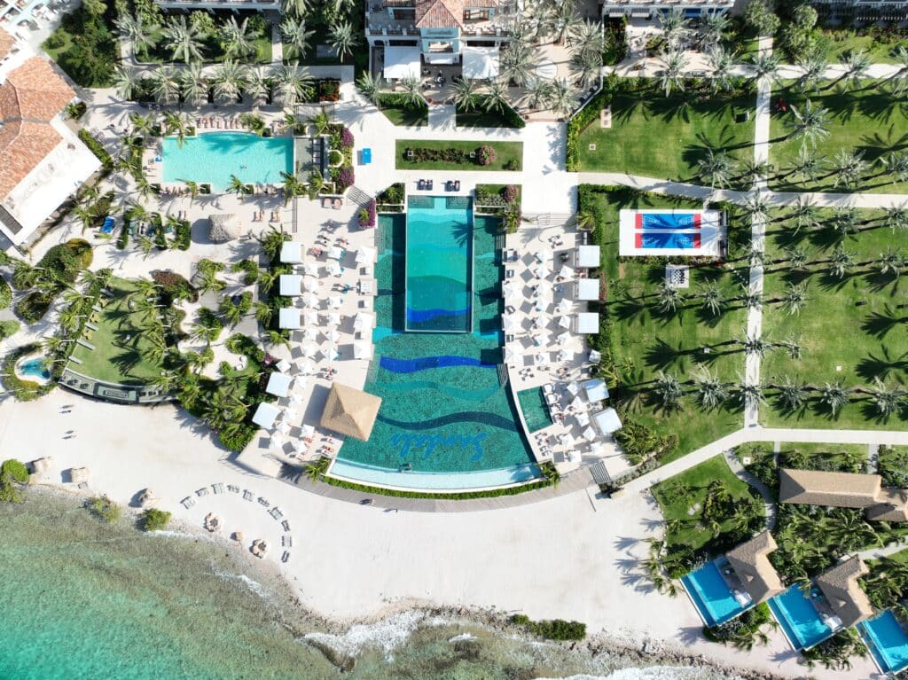 A photo of the Sandals Royal Curacao taken by Have Clothes, Will Travel with a drone. You can see the infinity pool, beach, bungalows, and main resort.