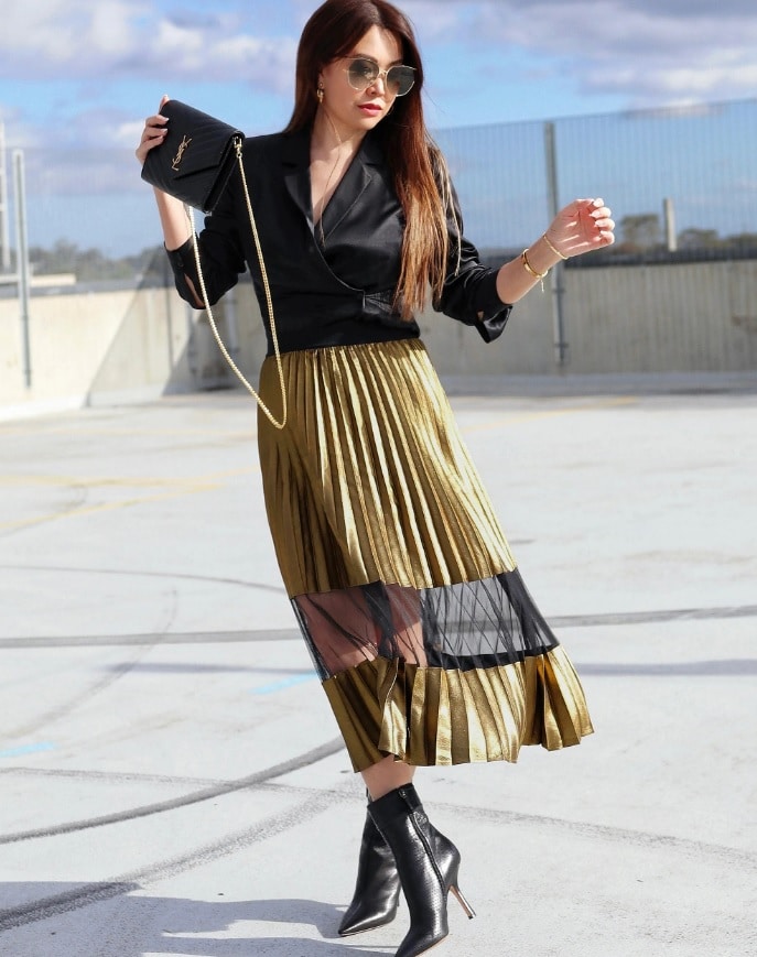 gold skirt outfit with black accessories and blouse