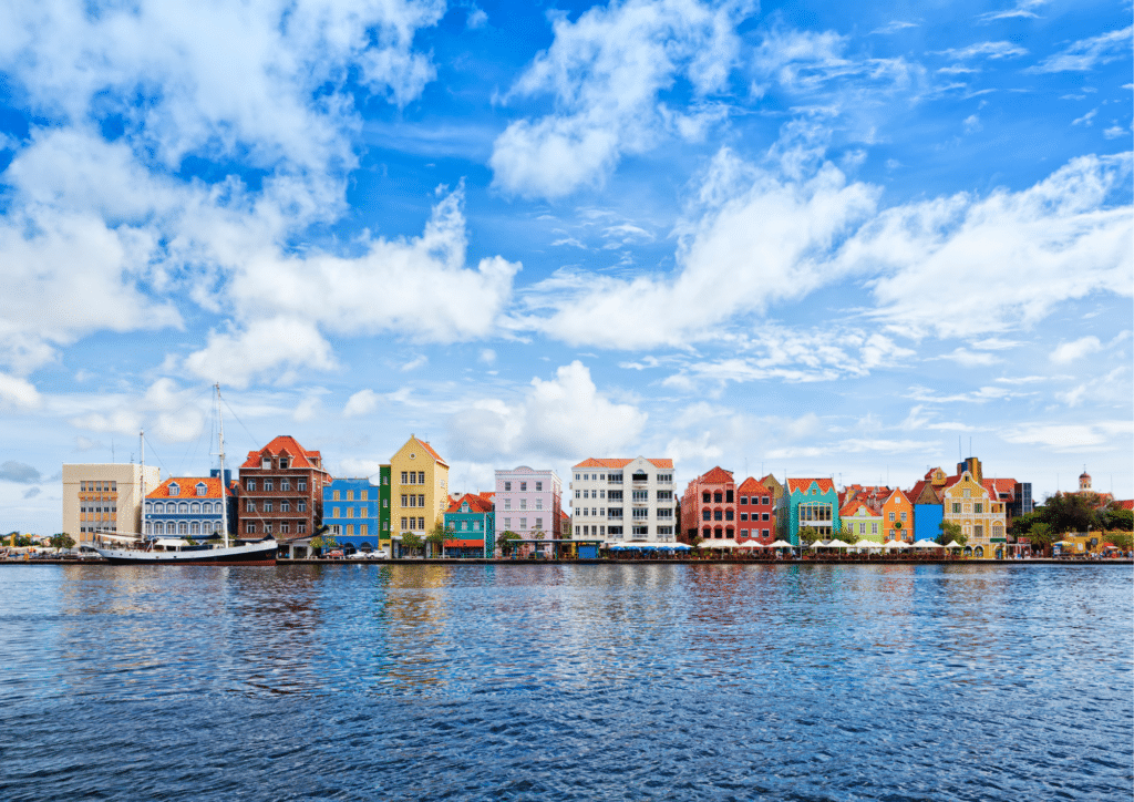 Colorful buildings on the shore of a body of water in Handelskade.