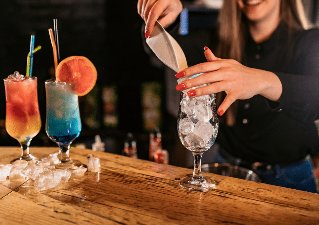 Bartender making fruity cocktails