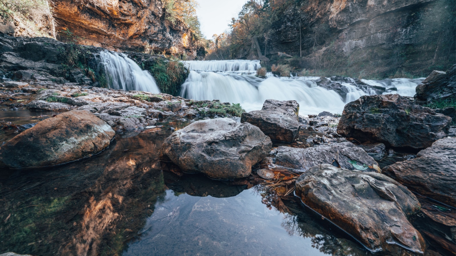 Waterfall at Willow River State Park in Hudson Wisconsin in fall. Daytime long exposure