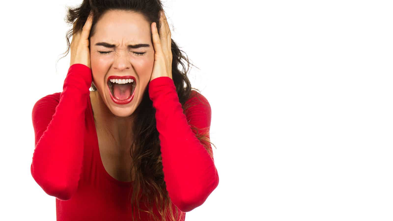 frustrated woman screaming, wearing red shirt and red lipstick