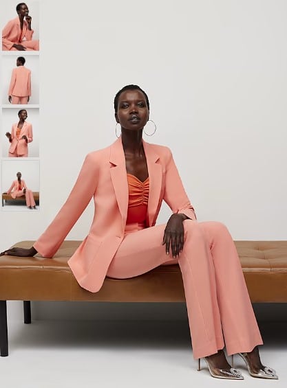 Woman wearing a salmon colored suit from New York & Company