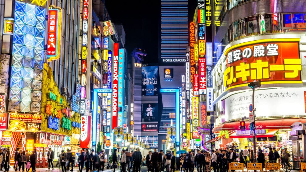 Tokyo / Japan - 11/09/2016: Shinjuku Neighborhood Illuminated by Neon Signs at Night
