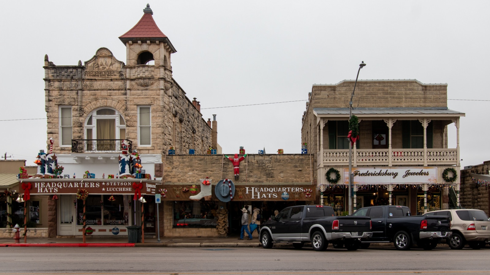 Fredericksburg, TX - USA - December `10 2019: Exterior of businesses on main street, including Headquarters Hats and Fredericksburg Jewelers