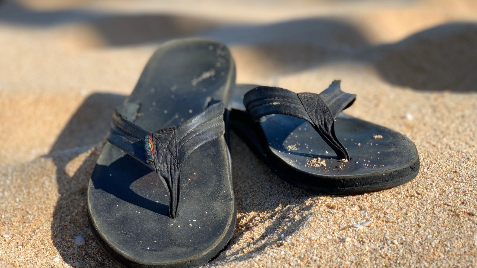 Oahu, Hawaii - March 20, 2020: Rainbow Sandals on Sunset Beach