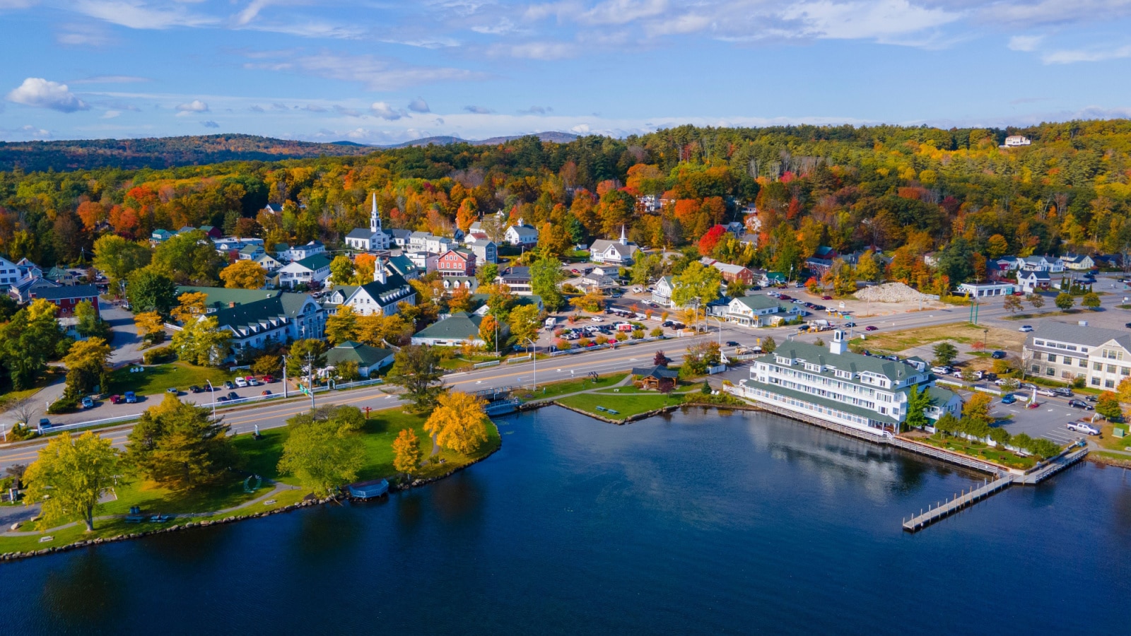 Meredith town center with fall foliage aerial view in fall with Meredith Bay in Lake Winnipesaukee, New Hampshire NH, USA.