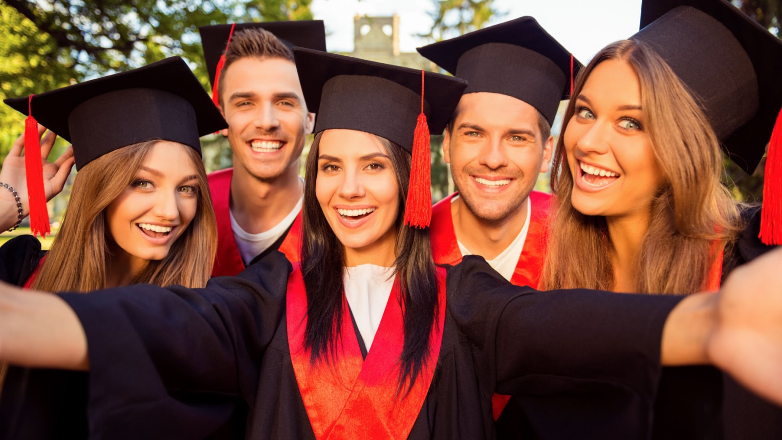 A woman in a graduation gown pointing at the camera photo – Free Female  Image on Unsplash