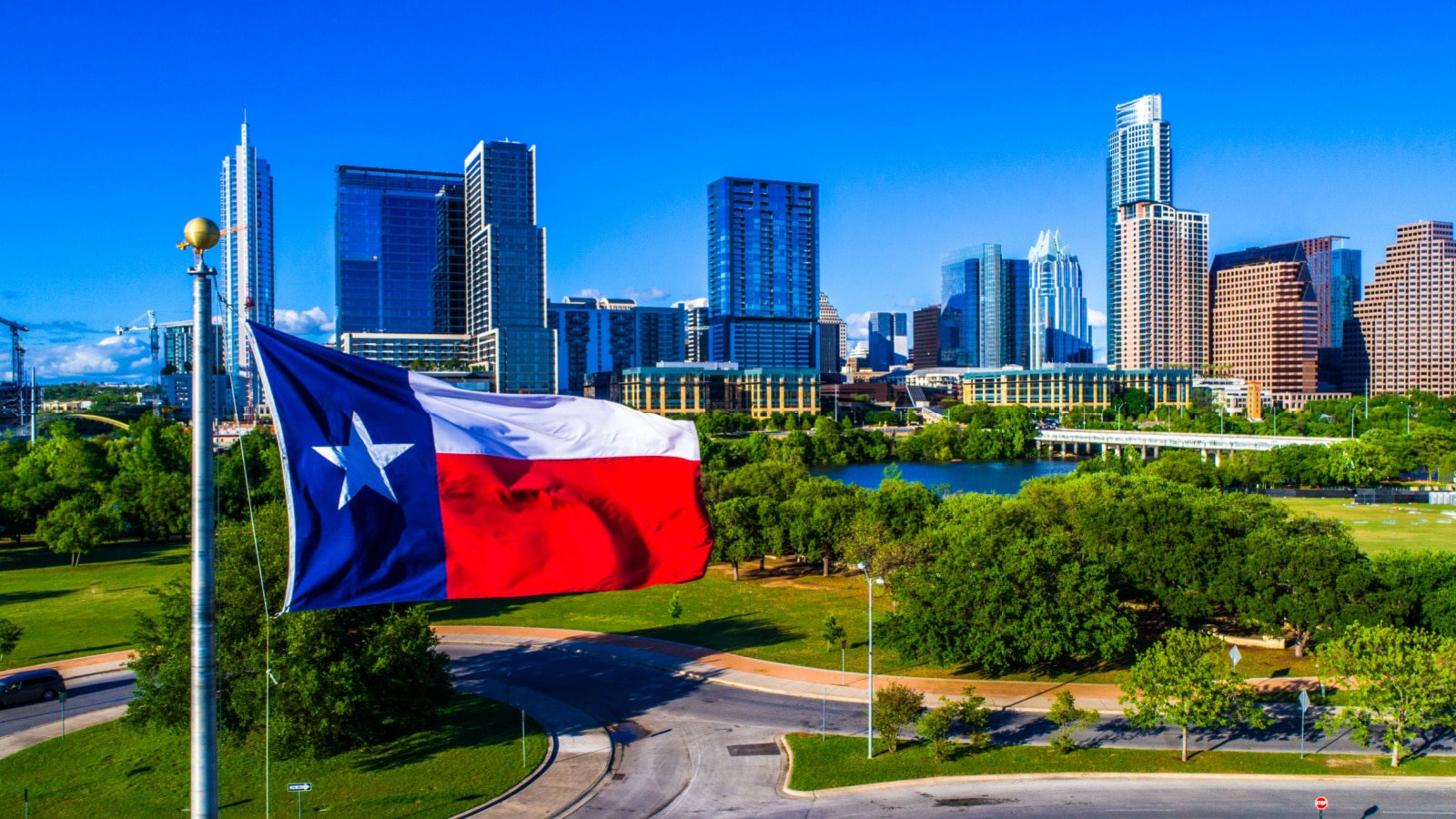 ATX City Skyline Texas Flag patriotic National Pride Displays the Lone Star State with a Colorful Austin Texas Skyline Cityscape Capital Cities Background on a Nice Sunny Summer Blue Sky Day