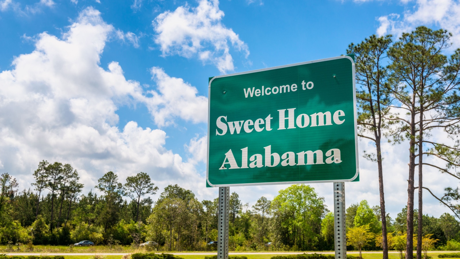 Welcome to Sweet Home Alabama Road Sign along Interstate 10 in Robertsdale, Alabama USA, near the State Border with Florida