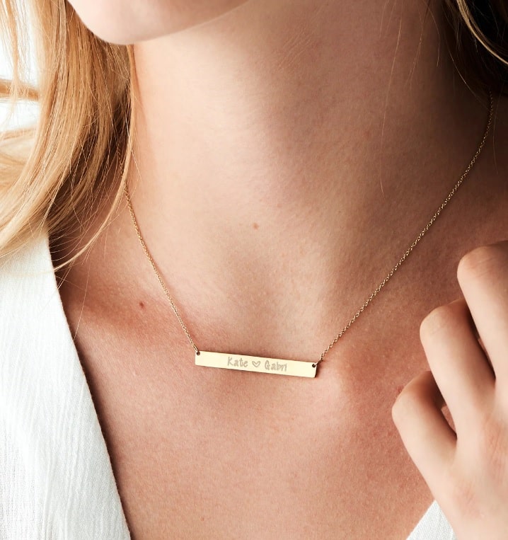 gold bar necklace with custom engraved names from Rellery
