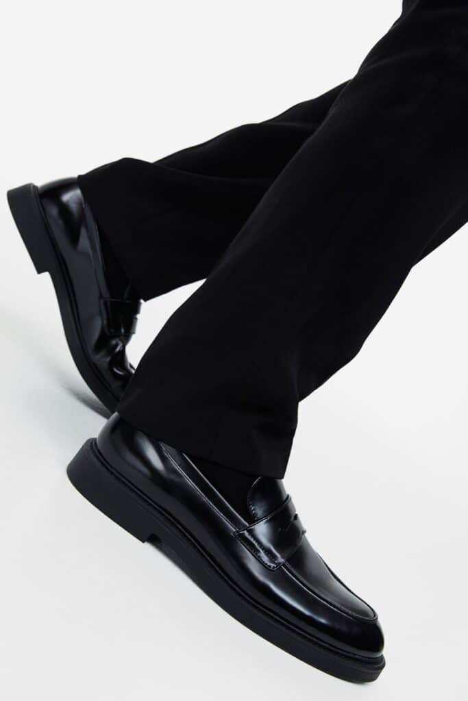 H&M black loafers paired with black pants
