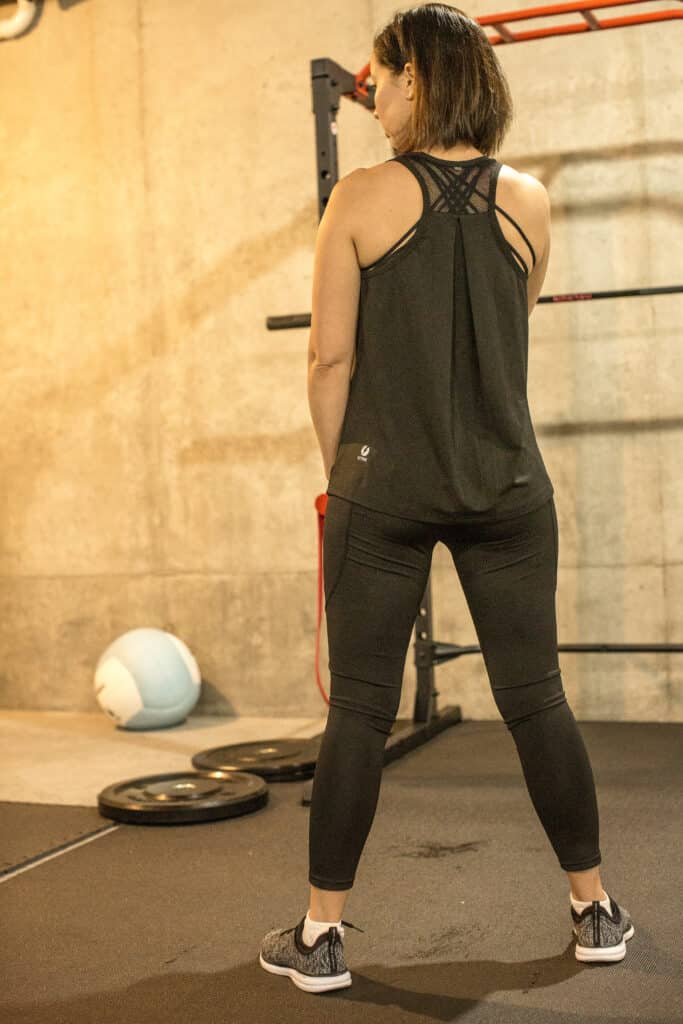 Solid Color U-neck Sleeveless Sports Tank Top by ICTIVE worn by Lindsey of Have Clothes Will Travel in a basement gym