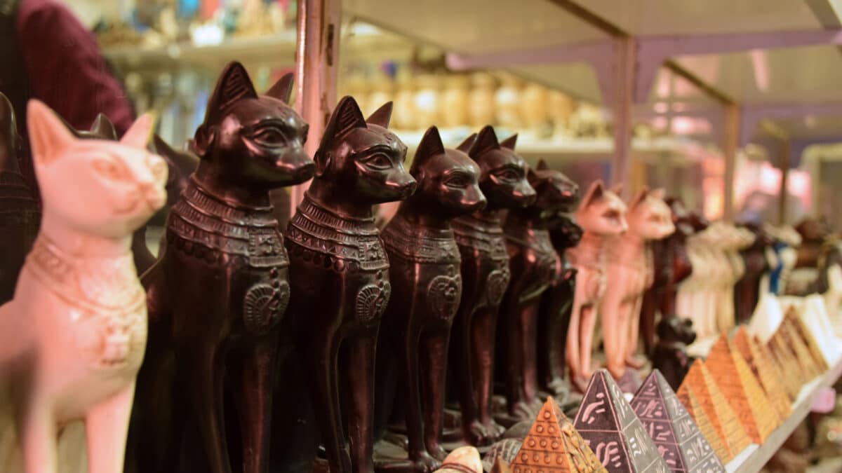 Egyptian Old Bazar with rows of carved cats and pyramids