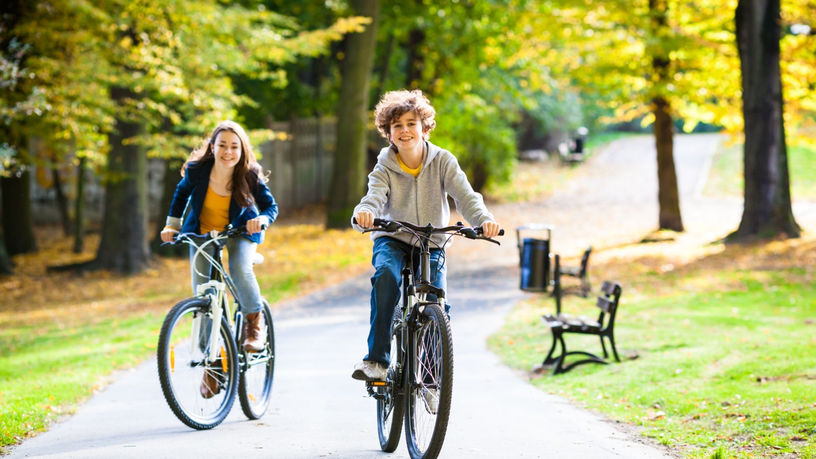 Urban biking - teens and bikes in city park