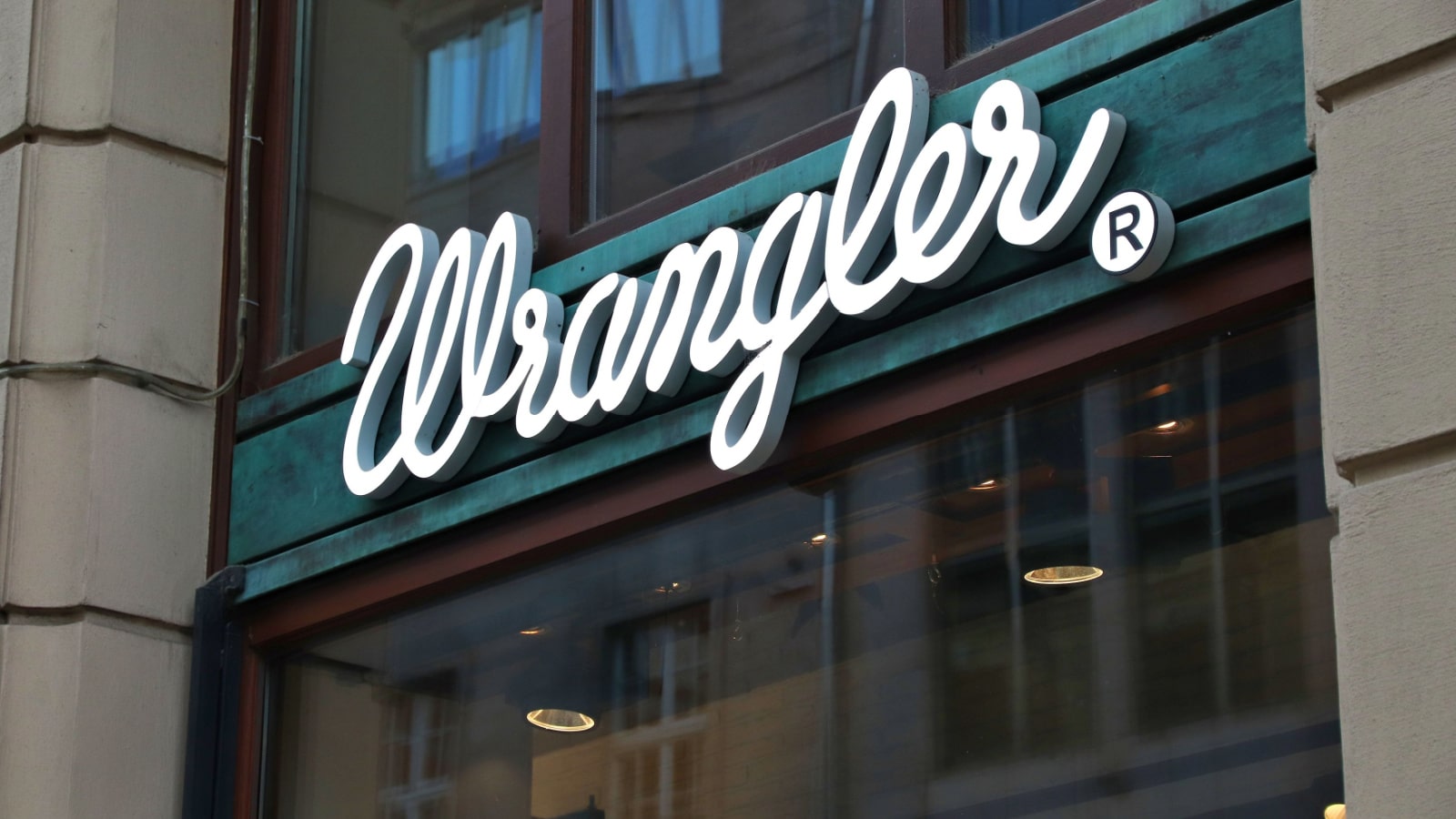 LEIPZIG, GERMANY - MAY 9, 2018: Wrangler store sign in Leipzig, Germany. Wrangler is an American brand of jeans owned by Kontoor Brands.