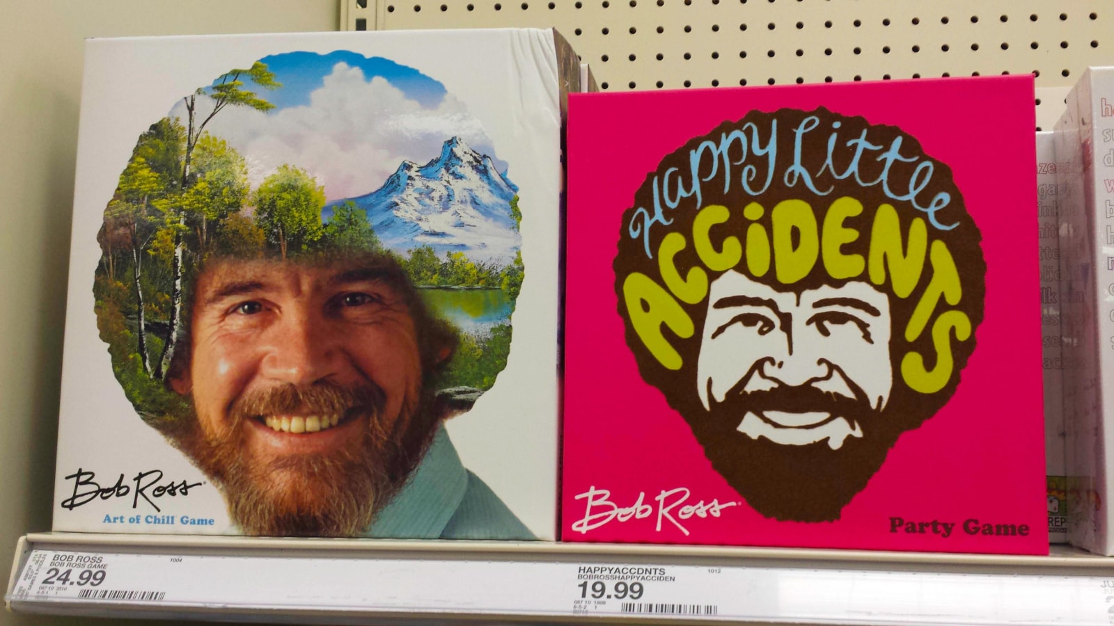 St. Petersburg, Florida / USA - August 2019: The Bob Ross Art of Chill board game next to the Bob Ross Happy Little Accidents Party Game on a shelf in Target.