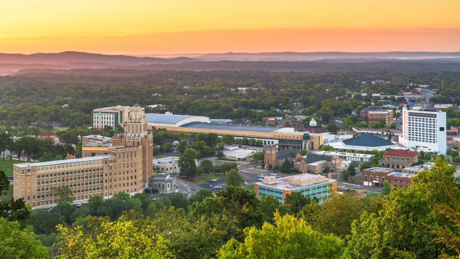 Hot Springs, Arkansas, USA town skyline from above at dawn.