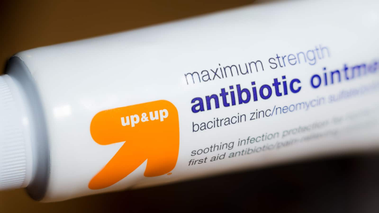 Trenton, MO / United States of America - September 9th, 2020 : Up & Up brand antibiotic ointment bottle, close up with dark background. Target store brand over the counter relief cream.