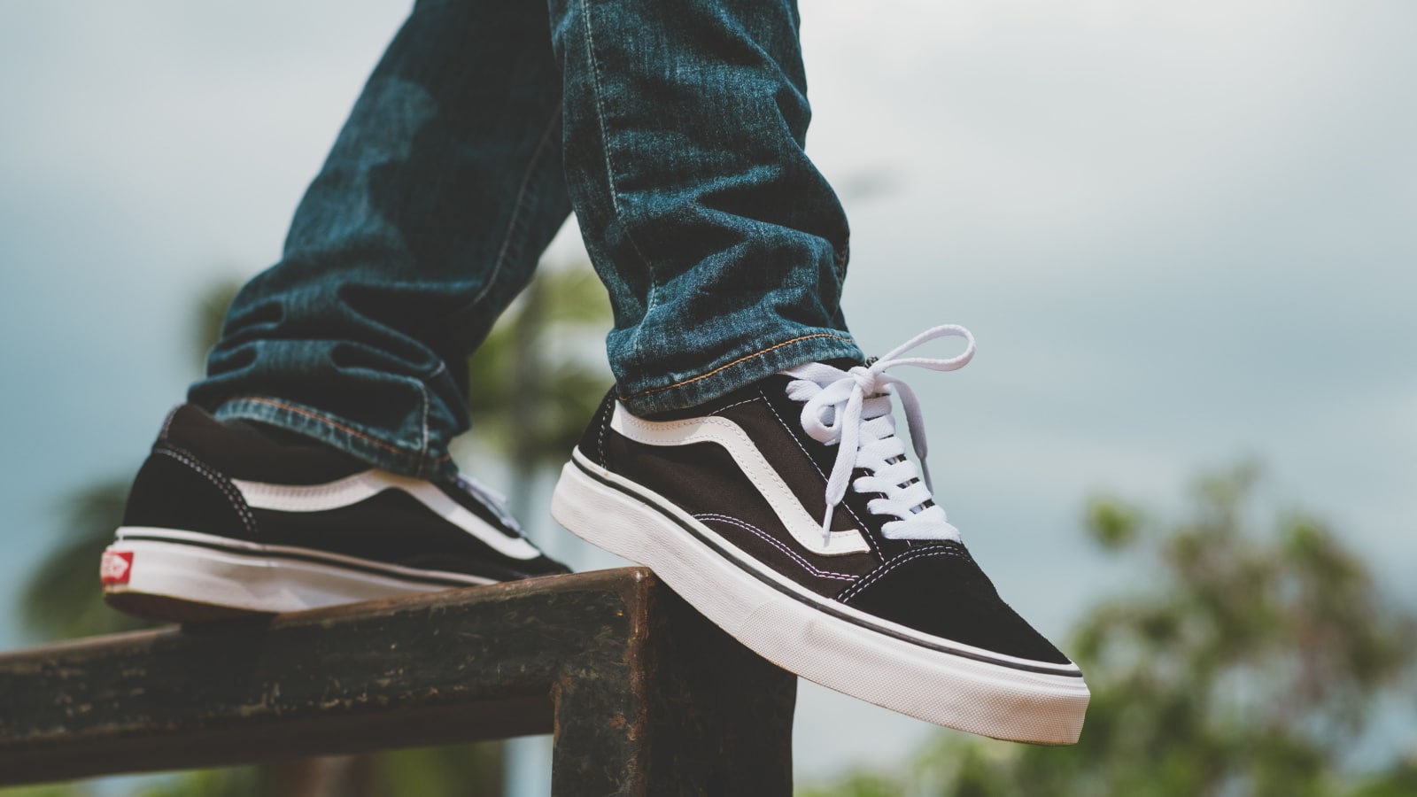 BANGKOK, THAILAND - FEBRUARY 01, 2022: The Vans Old Skool black and white sneakers. Vans is an manufacturer of skateboarding shoes.