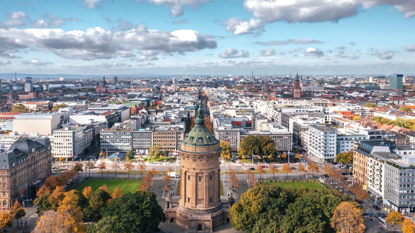 Autumn aerial cityscape of Mannheim city, Baden-Württemberg, Germany. Friedrichsplatz with the Mannheim Water Tower (Wasserturm) in the foreground