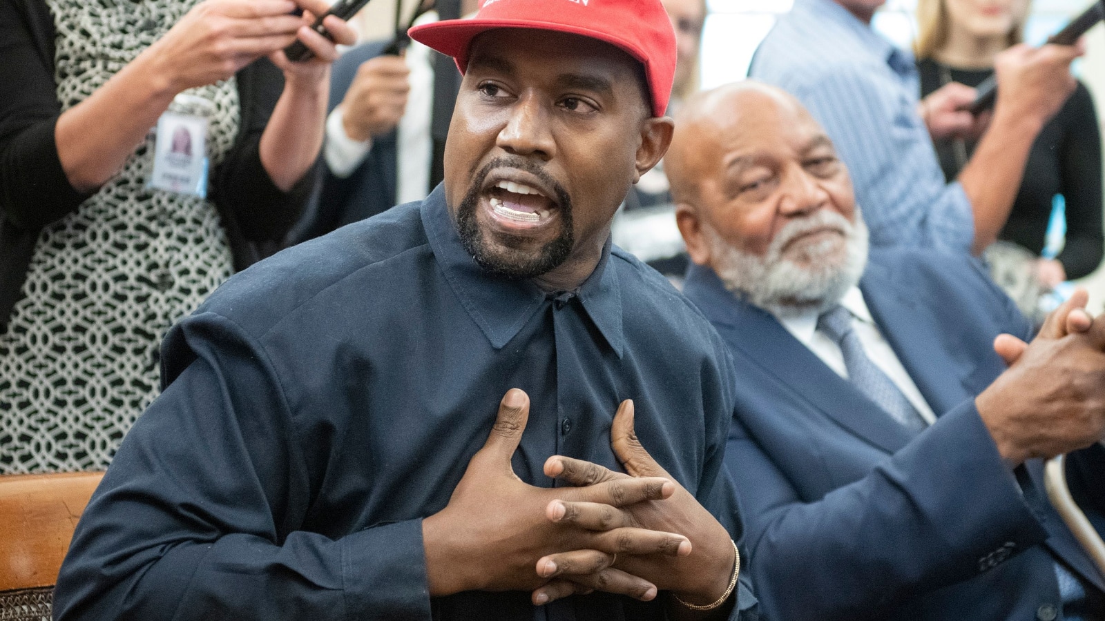 Washington, DC US - Oct 11, 2018: Jim Brown looks on as Kanye West speaks as he meets with US President Donald J. Trump in the White House Oval Office. Credit: Ron Sachs - CNP