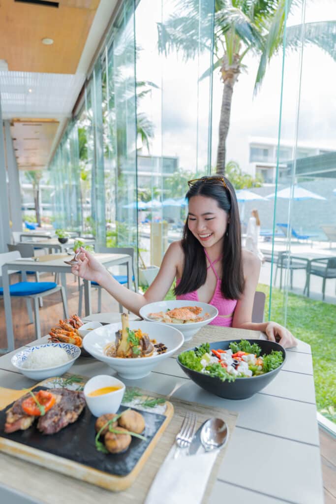 Travel influencer enjoying breakfast at Explorar Hotels & Resorts in Thailand