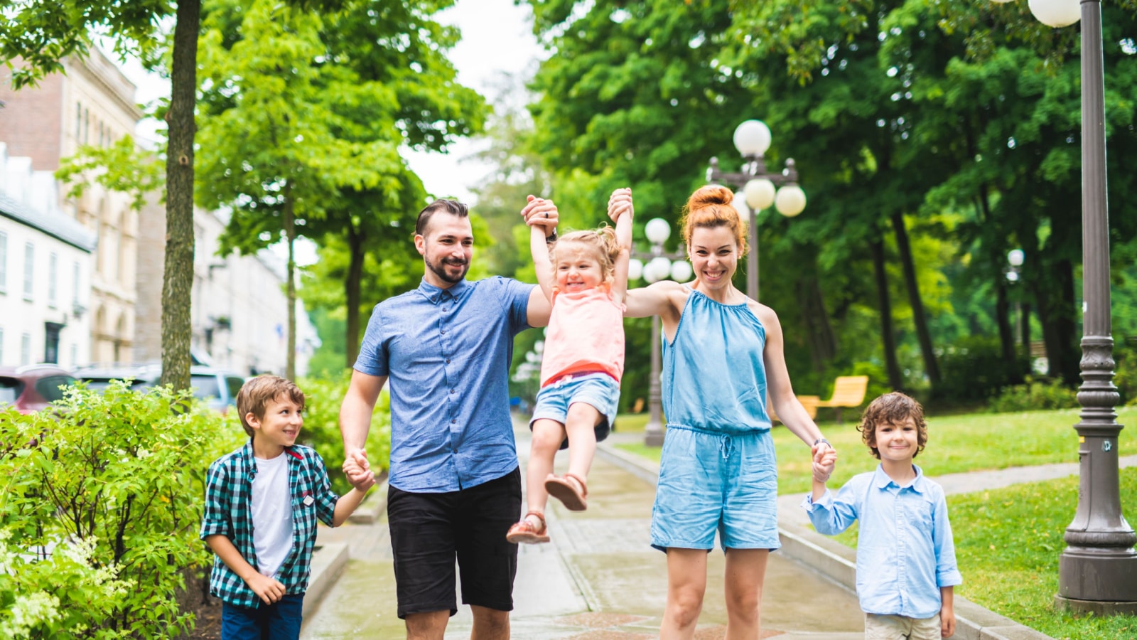 Happy familly of five in the park