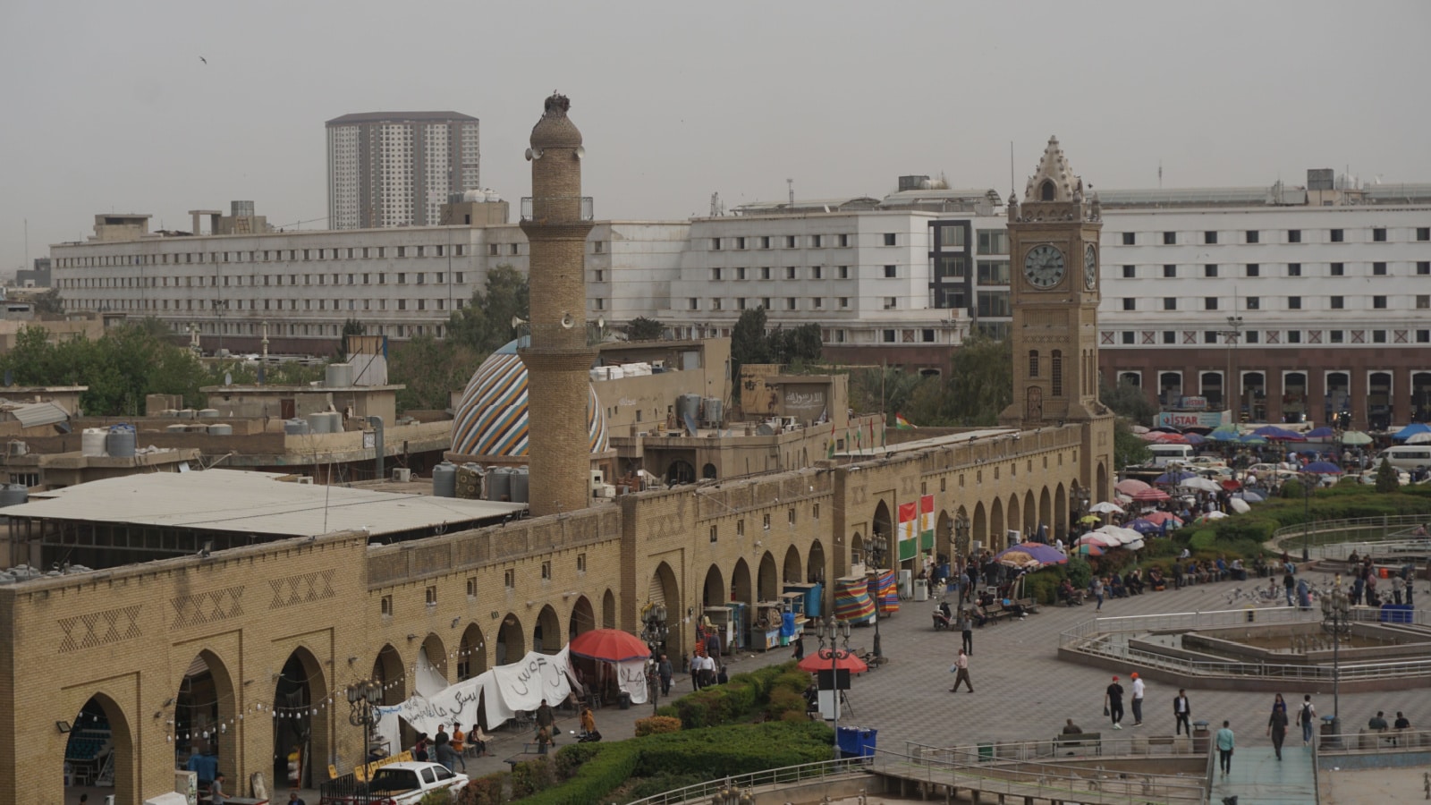 Erbil, Iraq - June ``1, 2022: View of the Clock Tower at Bakhi Shar Park from Erbil Citadel