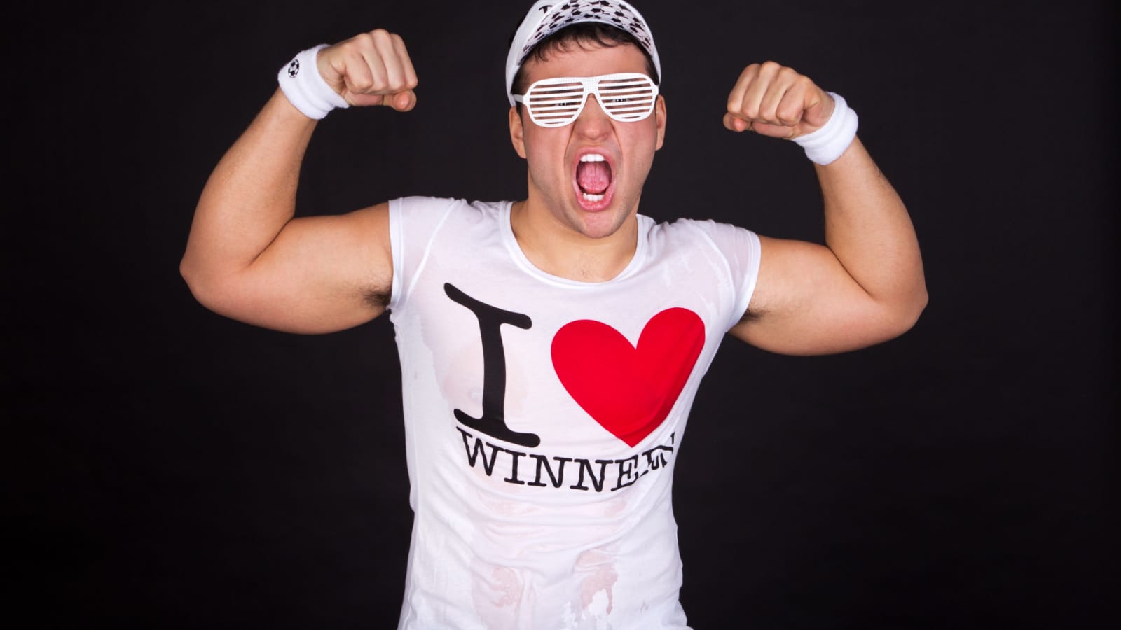 Portrait of an excited young guy soccer fan wearing shutter shades