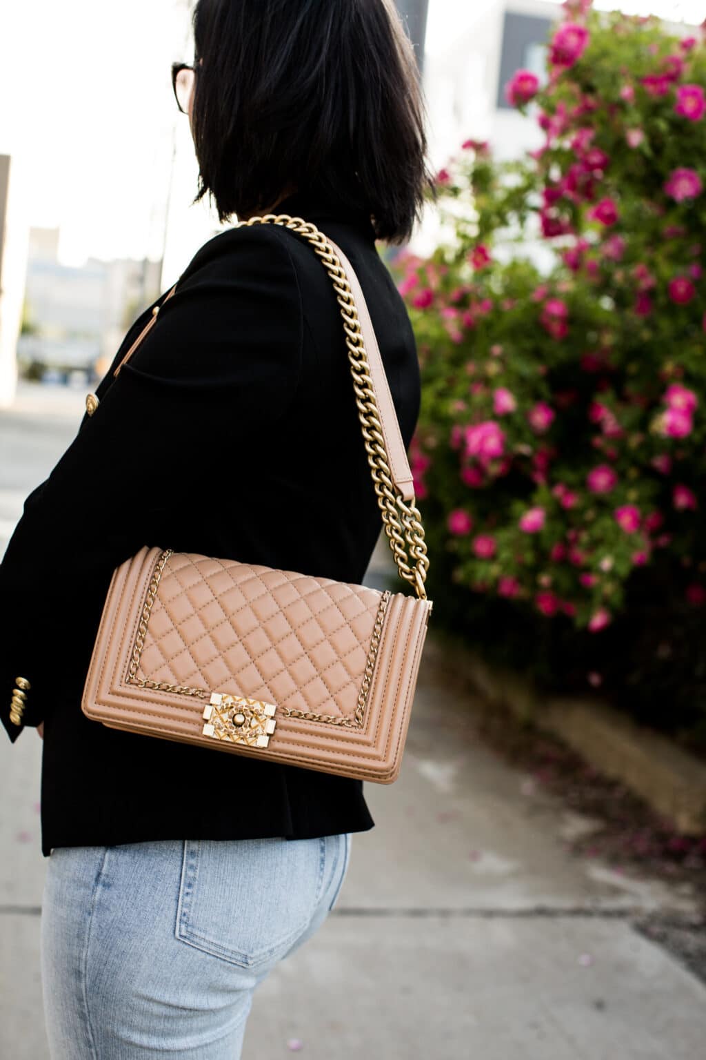 Chanel boy bag styled with black blazer and jeans