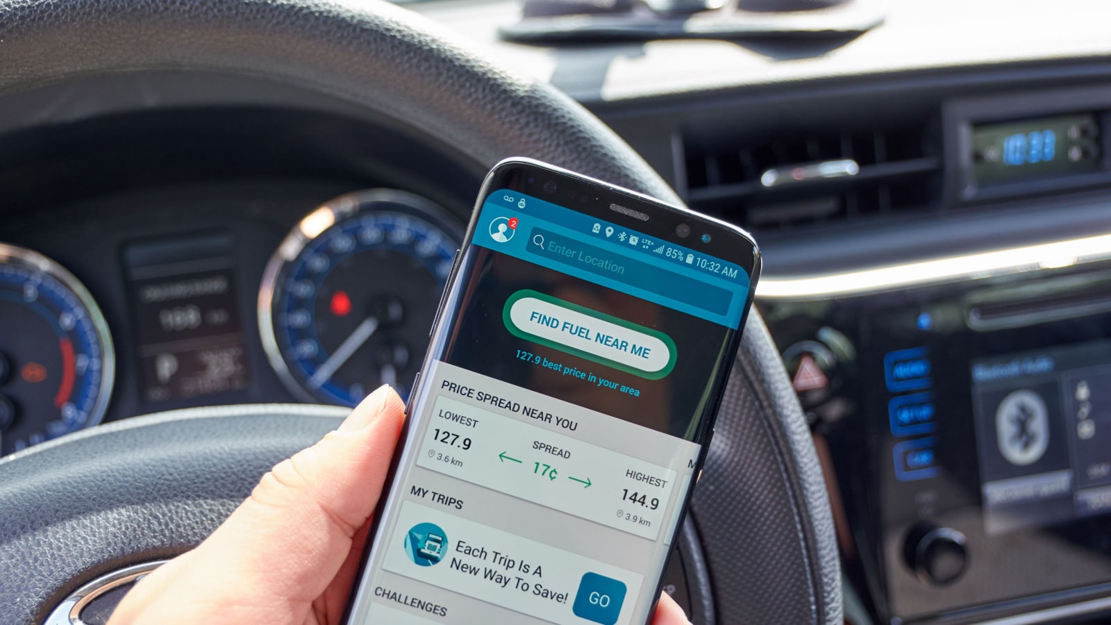 TORONTO, CANADA - JULY 15, 2018: GasBuddy mobile app on s8 screen in a hand. GasBuddy is company that operates apps and websites based on finding real-time fuel prices