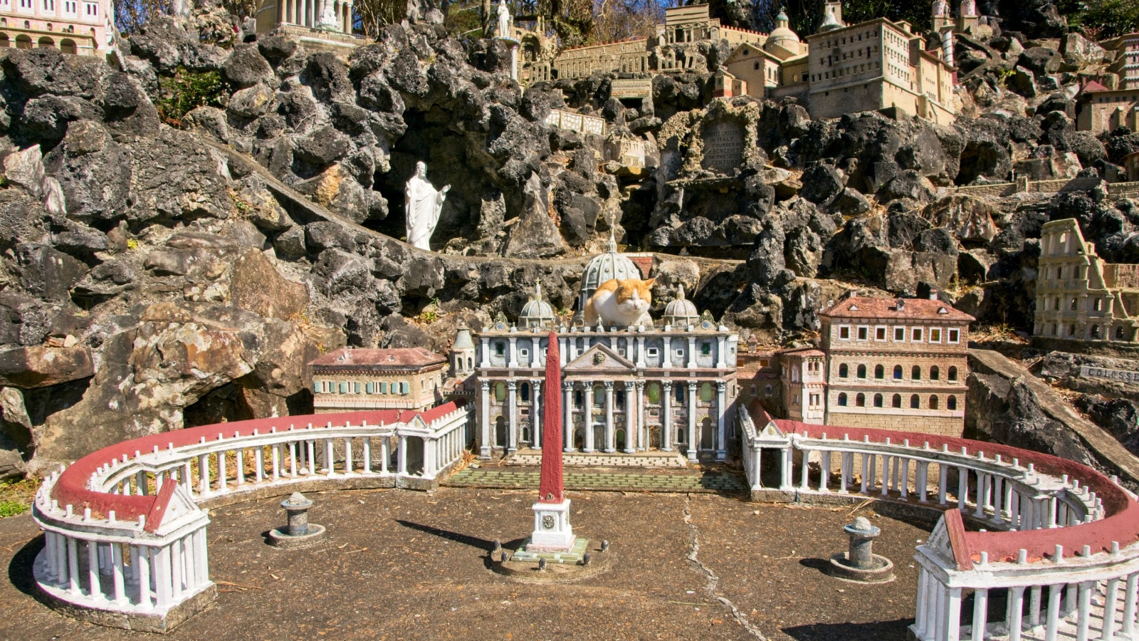 Cullman USA - 13 February 2015 -Cat on top of model of St. Peters Church of Rome in Ave Maria Grotto in Cullman Alabama