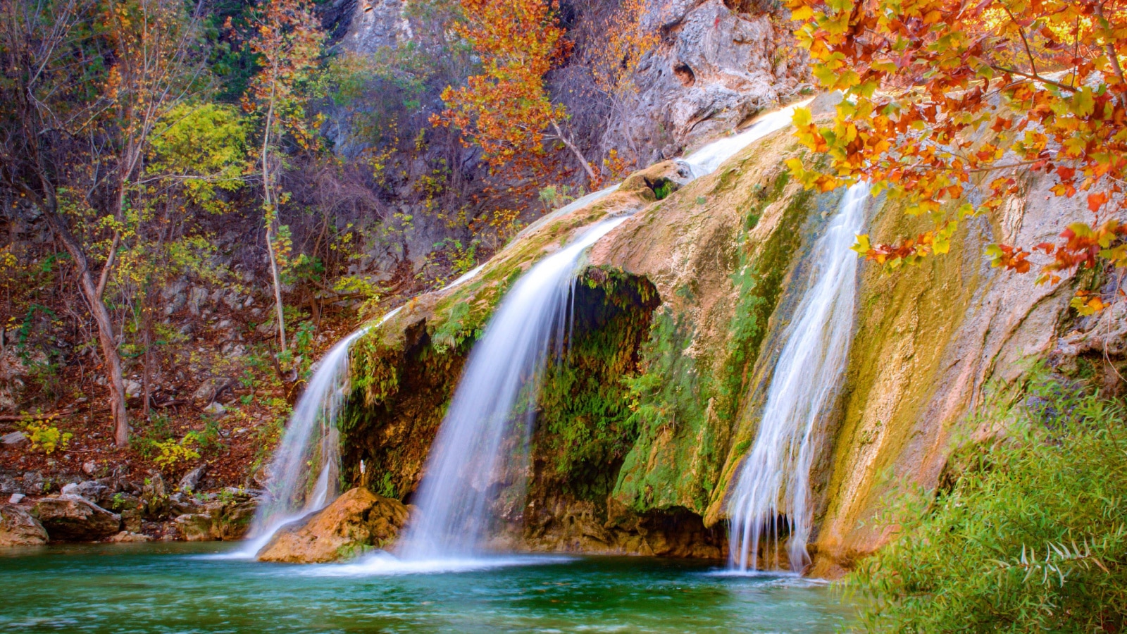 Color photograph of Turner Falls waterfall (near Davis, Oklahoma) during fall / autumn.