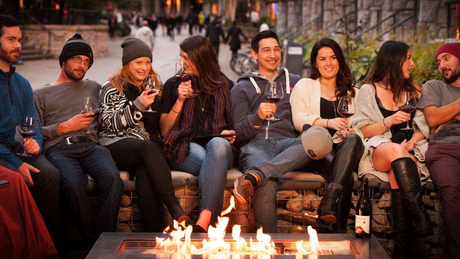 Whistler BC, Canada - September 18th, 2015: A group of friends at a fireplace booth at a Whistler restaurant.