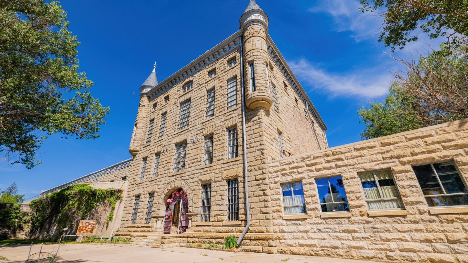 Sunny exterior view of the Wyoming Frontier Prison Museum at Wyoming