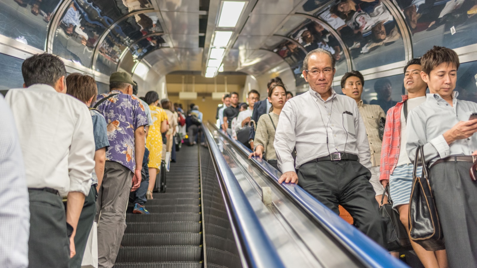Tokyo, Japan July 15, 2016 - Middle aged businessman commutes via Tokyo subway system.