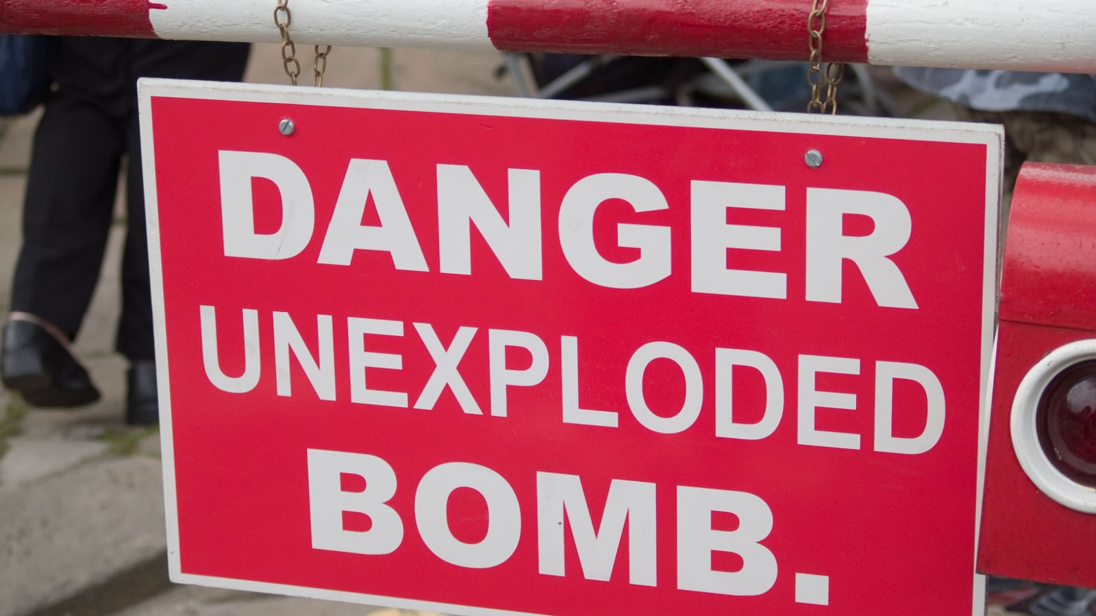 Danger unexploded bomb sign at a wartime reenactment event in the UK.