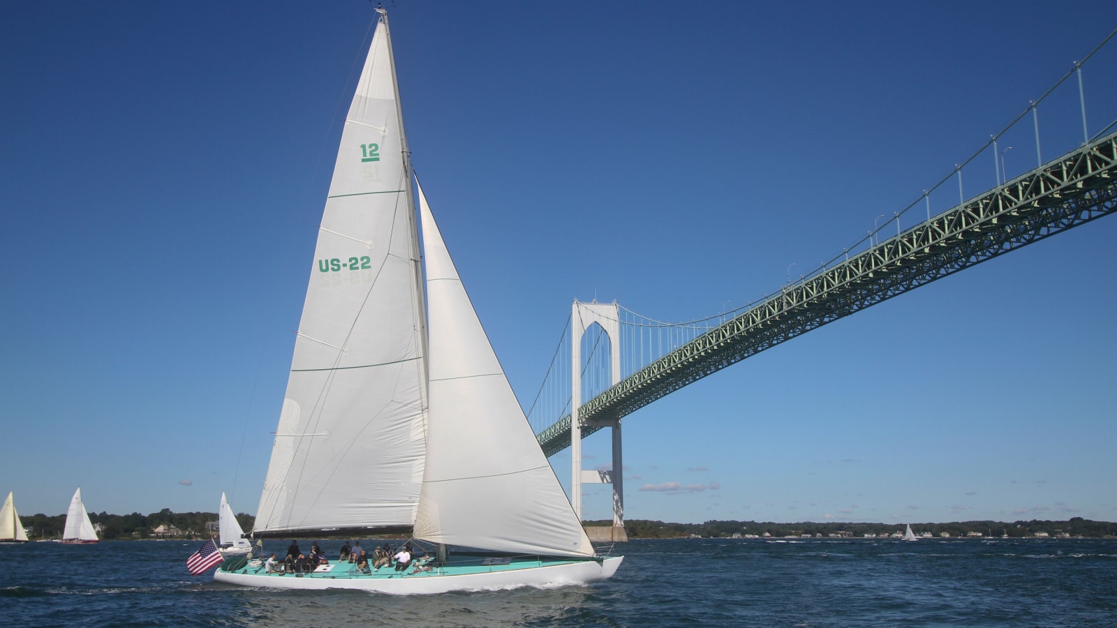 NEWPORT, RI - SEPTEMBER, 10: 12 Metre America's Cup Intrepid approaches Yaquina Bay Bridge during race in 2010 Newport Bucket Regatta on September 10, 2010 in Newport, RI.