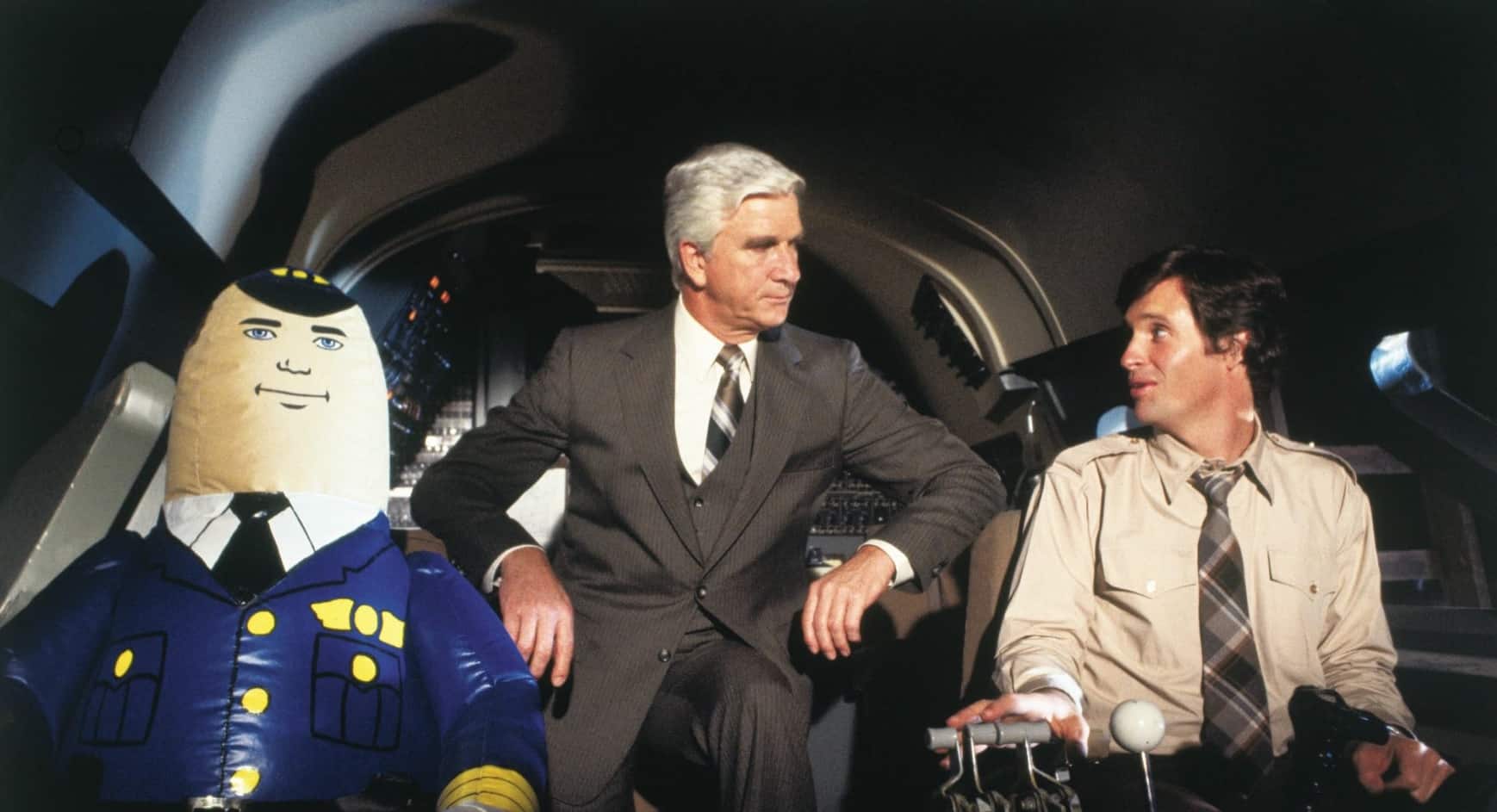 Leslie Nielsen, Robert Hays, and Otto in Airplane! (1980)