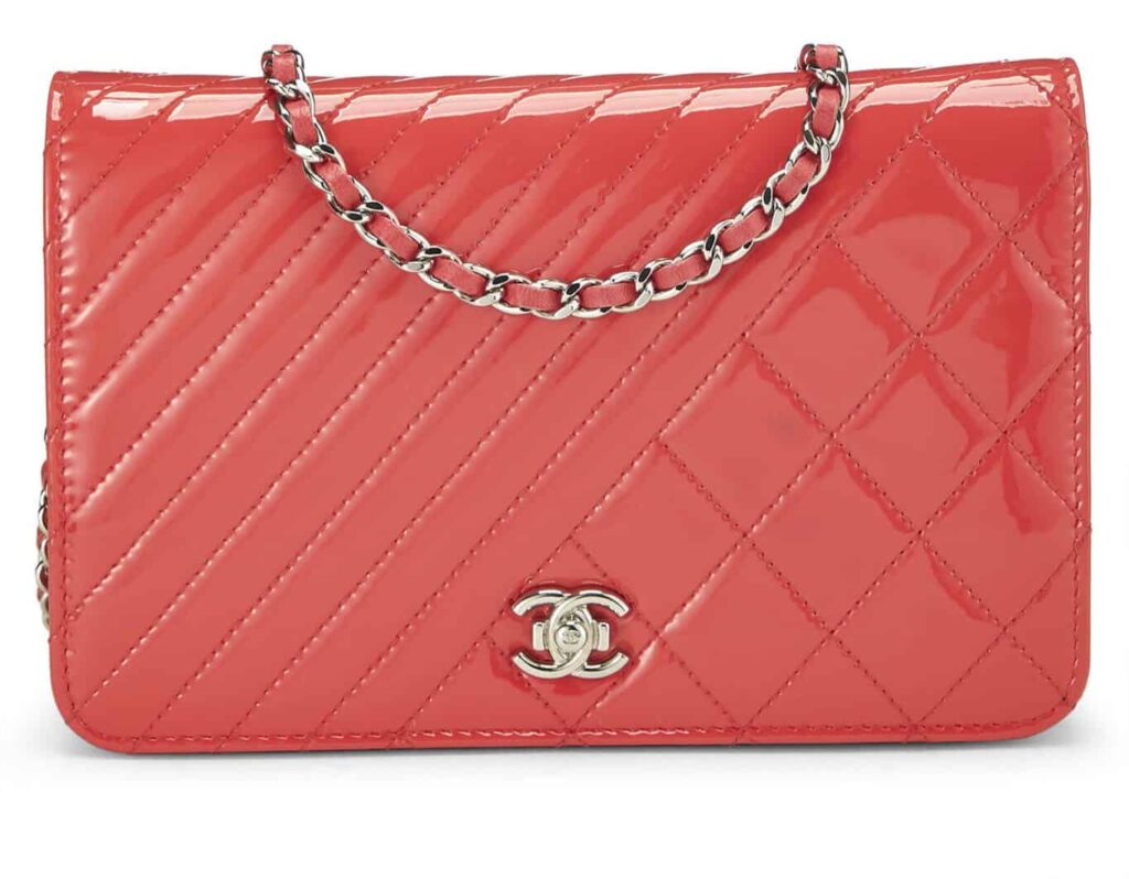 CHANEL
PINK QUILTED PATENT LEATHER WALLET ON CHAIN (WOC)
